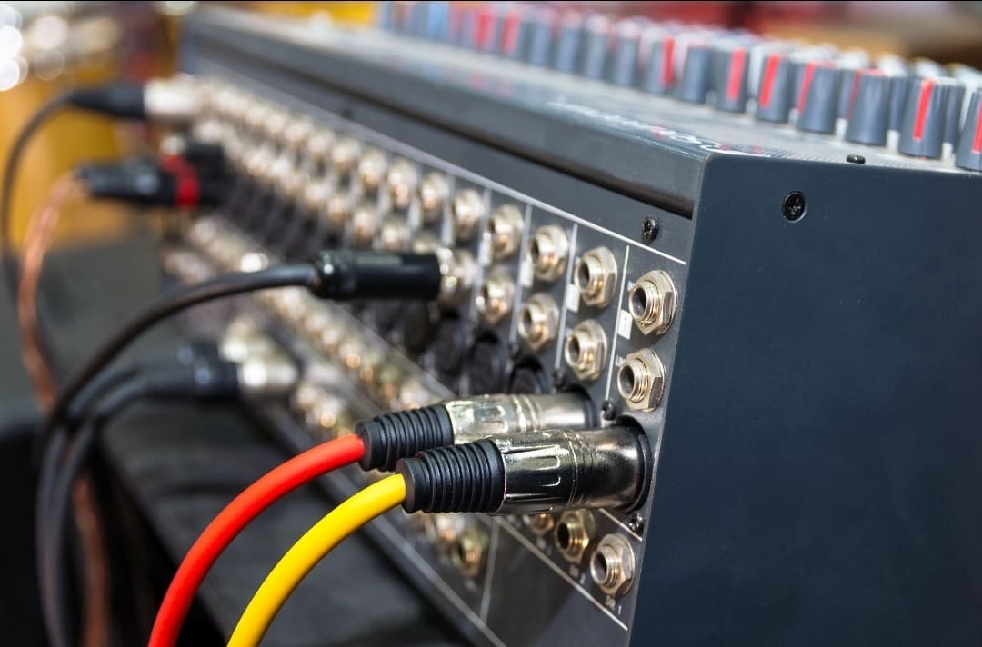 Audio cables plugged into a patchbay on a Zadeking sound system