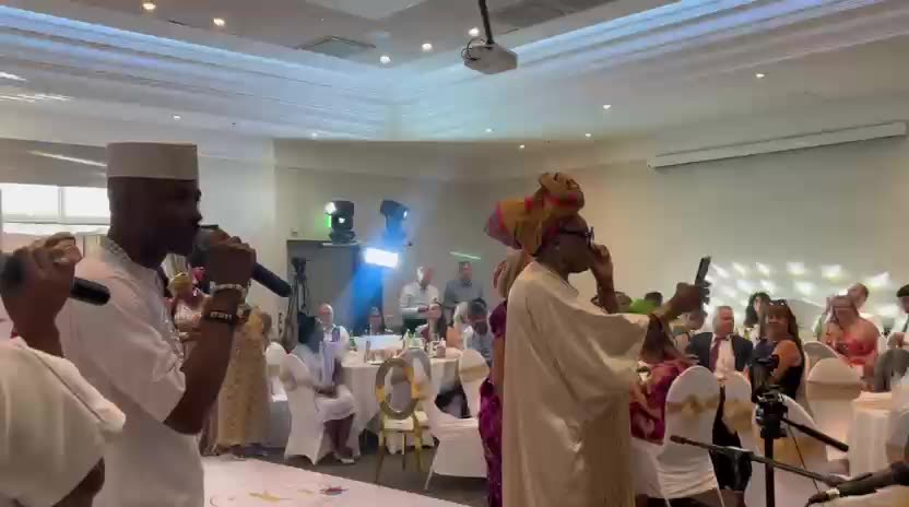 Zadeking live band performing in traditional attire at a celebration